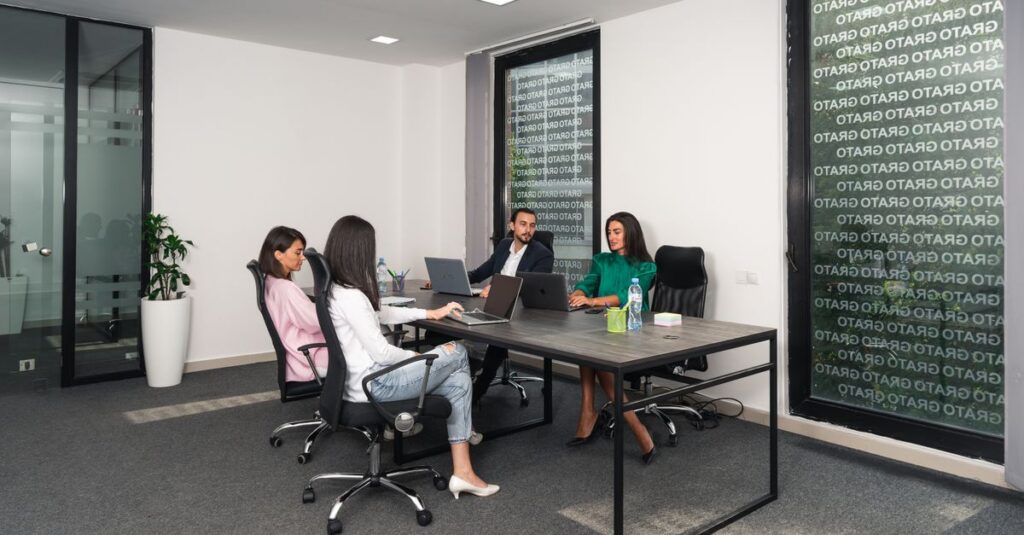 A professional team engaged in a meeting in a modern office setting in Georgia.