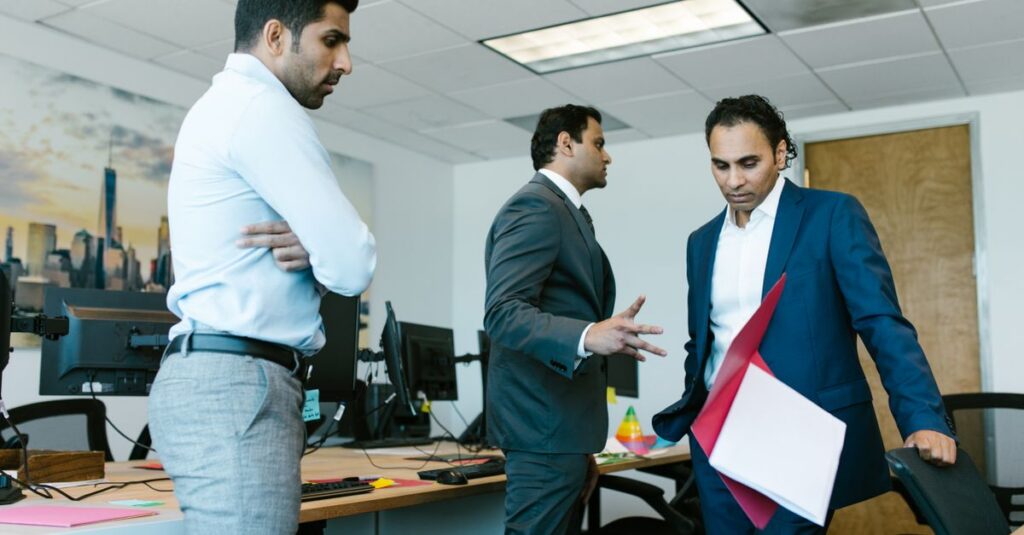 A tense moment captured among colleagues during a business meeting in a modern office setting.