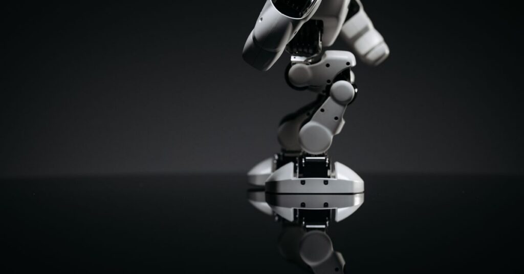 A close-up image of a mechanical robotic arm reflecting on a dark surface, capturing industrial innovation.